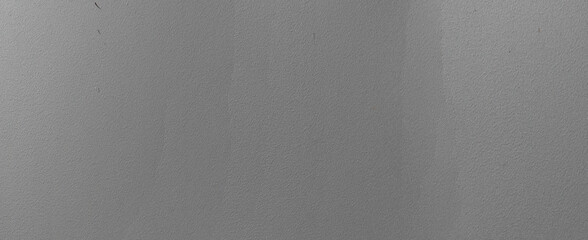 Panoramic view of a painted metal door surface with a rough texture, viewed up close