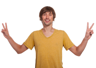 Young man joyfully celebrating with peace signs against a bright backdrop