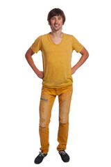 Fototapeta premium Confident young man in vibrant yellow attire posing against a plain backdrop