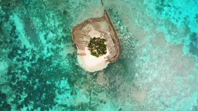 Drone view of Guyam Island with tropical Sandbar, Clear Water, and vegetations at the daytime