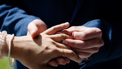 Exchanging rings, couple celebrating wedding ceremony with love and commitment