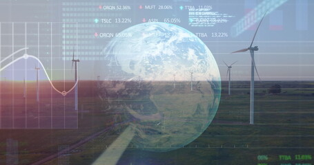 Image of graphs, globe and data processing over wind turbine at sunset