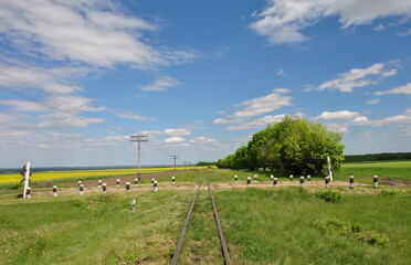 beautiful rural landscape with an old railway stretching into the distance