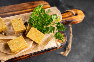 Broth cube vegetable, meat broth concentrated broth chicken, pork, beef meat natural food fresh dish on the table rustic food top view copy space