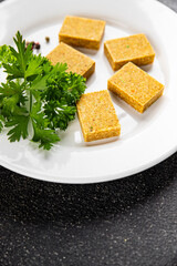 Broth cube vegetable, meat broth concentrated broth chicken, pork, beef meat natural food fresh dish on the table rustic food top view copy space