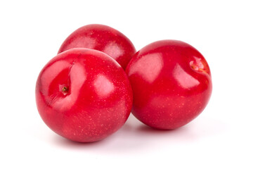 Red plums, fresh and ripe fruit isolated on white background.