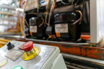Emergency Stop installed at line conveyor in refrigerator manufacturing plant.