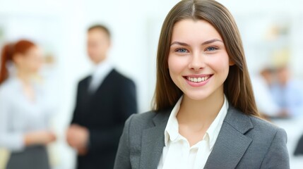 Professional woman in business attire smiling confidently.