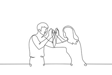 man and woman smiling and slapping both palms at the same time - one line art vector. Pat-a-cake, double high five or high ten concept