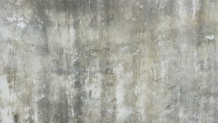 Rough grey concrete wall textured with detailed crack patterns, suitable for background and industrial themes.