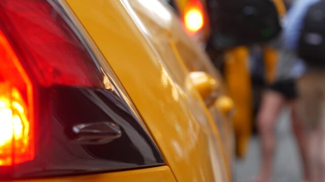 New York City Grand Central Terminal railway station, 42 street. Manhattan Midtown. Yellow taxi cab row, car transport on Pershing Square, NYC, USA. American urban road traffic, people pedestrians.