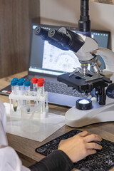 Modern lab with microscope and test tubes