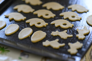 Linz dough cut out on a baking sheet.
