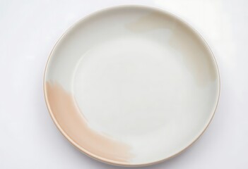 white plate with a brown spot on it