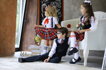 Fototapeta premium Uniformed schoolchildren posing for the camera