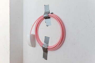 newly laid fiber optic house connection in the basement of an older residential building