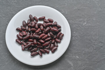 boiled beans on a white plate.