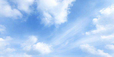 Obraz premium Serene sky filled with light cumulus clouds drifting slowly across calm summer backdrop, creating peaceful and tranquil atmosphere