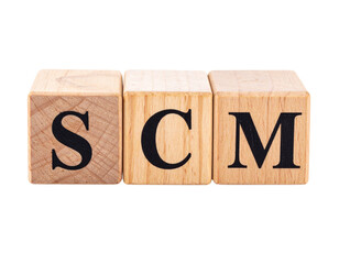 Wooden blocks displaying the letters S, C, and M in bold black font.