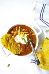 Homemade Black bean soup with totilla cips, selective focus