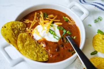 Homemade Black bean soup with totilla cips, selective focus