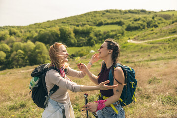 Friends Hugging While Hiking