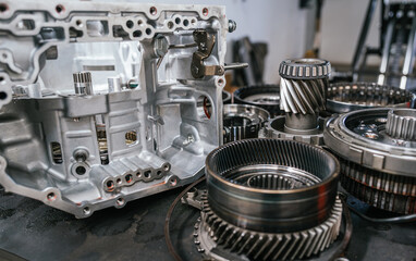 Close up of car transmission gears and parts during maintenance