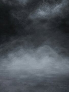 Eerie fog rolling over concrete floor in studio shot creating a mysterious atmosphere with dark background and dramatic lighting
