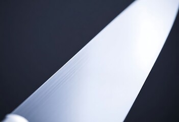 close up of a large knife on a black background