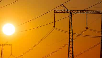 High-voltage power lines at dusk or dawn