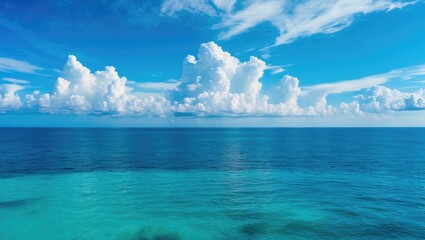 Fototapeta premium Colorful coastal view featuring a sunny sky, ocean, and sandy beach