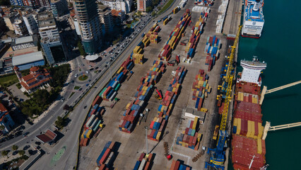 Fototapeta premium Top-Down Aerial View of Cargo Containers, Cranes, and Ship in Durrës Port 