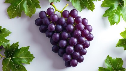Juicy grape bunch with surrounding green leaves against a plain background
