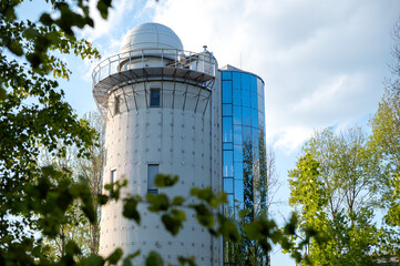 A beautiful astronomical observatory against the sky with clouds.