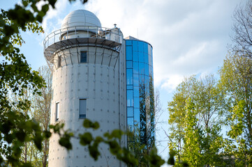A beautiful astronomical observatory against the sky with clouds.