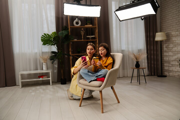 Obraz premium Woman and Teen Girl Learning About Online Shopping Together