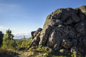 Exploration of rugged terrain in Medeira with striking rock formations and clear blue skies