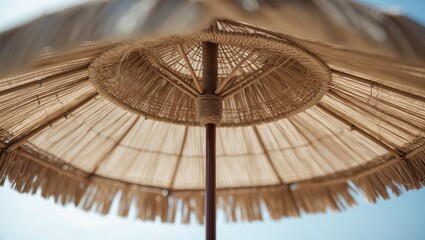 Idyllic coastal setting with handmade woven beach umbrella in tropical climate