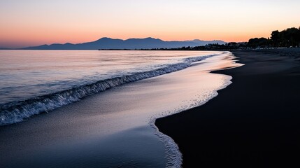 Serene twilight scene displaying a gently rolling wave on the beach