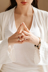 Woman hands in yoga symbolic gesture mudra