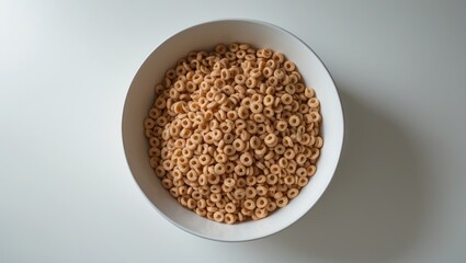 Bowl of Cheerios with honey, separated on a white background