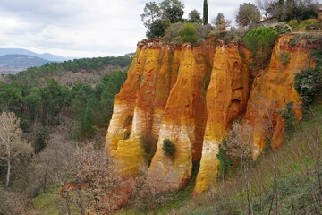 View of the colorful ocher rocks  in Roussillon, France on a cloudy day