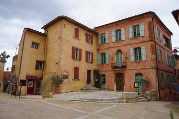 colorful old buildings in the village of Roussillon, France