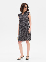 Pregnant girl model in stylish clothes on white background in studio.