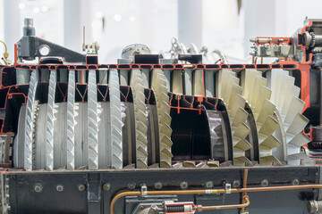 Detailed view of a jet engine cross-section showcasing turbine and compressor components in a...