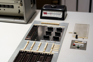 Control panel featuring vintage equipment in a studio setting during a daylight workspace