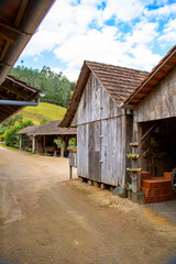 An old half-timbered (Fachwerk) house showcasing traditional German-style architecture, photographed on a bright sunny day with a clear blue sky. A picturesque symbol of cultural heritage and timeless