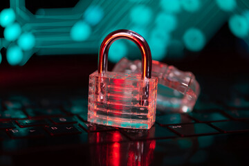 Lucent Security Paradigm A translucent padlock safeguards a digital infrastructure landscape on a glowing keyboard surface