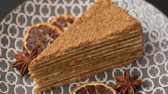 A slice of honey puff cake or pumpkin, carrot and cream pie, vegan sweets for the dinner table