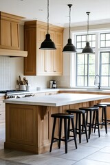 Modern, light-filled kitchen with wooden cabinets and island.